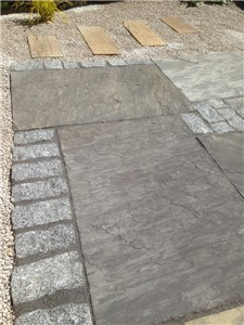 The black colouring shines through in the Sagar, when this blend of paving is wet.  This clever mix offers a mix of black and grey paving slabs but with a unique cream and brown natural textured veining.