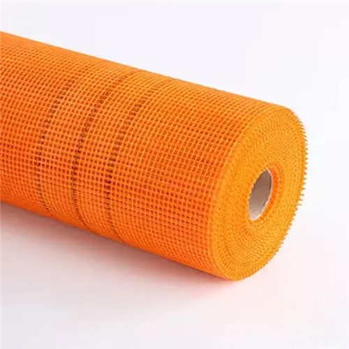 The Orange Fibreglass Mesh is an integral component of both render and EWI Systems. The strong and flexible Fibreglass Mesh is embedded with the cement-based basecoat layer (either EWI-220 EPS Basecoat or EWI-225 Premium Basecoat)  – this ensures the final render / solid wall insulation system is both strong (to withstand impact) but also flexible so it will be able to withstand natural building movements that occur during the different seasons.

The Orange Fibreglass Mesh can also be used in areas that need additional strengthening – for example, stress patches can be cut from the roll (300mm x 200mm) that are put 45 degrees to each corner of an opening. In traditional sand and cement areas, these areas are particularly likely to crack. The addition of a stress patch in these areas ensures the system will remain crack-free long into the future.

When using the Orange Fibreglass Mesh, ensure that each strip overlaps the last when embedding it within the basecoat adhesive or premium adhesive. There is a black marker printed on the mesh that indicates the overlap required. You can also ‘double-mesh’ if an area requires particular strengthening above and beyond our normal EWI / render systems. In order to do this, initially embed the mesh in vertical strips down the wall. Then embed the second layer of mesh at 90 degrees to this. In order to embed both layers of EWI Orange Fibreglass Mesh within the adhesive you may need to make the basecoat layer slightly thicker – e.g. 8mm instead of the recommended 6mm.

Obviously, the primary purpose of the Orange Fibreglass Mesh is to be used within the basecoat layer of either render systems or EWI systems, but it can be used to bridge cracks externally/internally or for giving extra strength to floor screeds as well as plastered ceilings.

Fibreglass Mesh is coated with acrylic acid co-polymer liquid, making it water, alkali and age resistant.